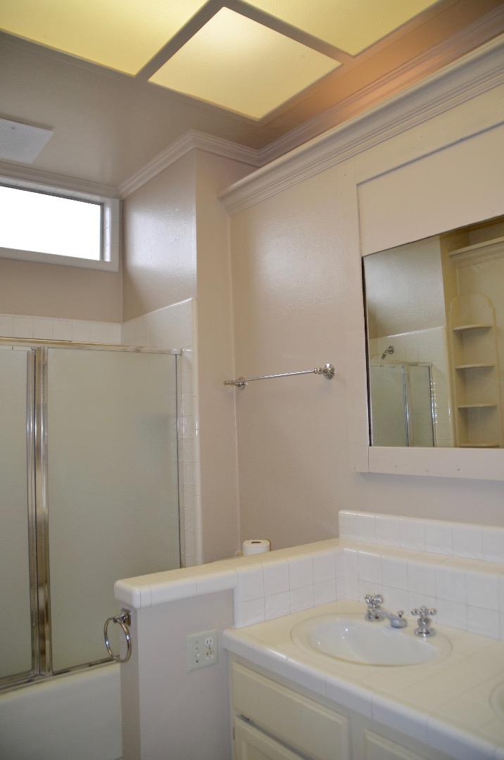 2890 Roop Road Gilroy, CA 95020 - Photo 14 of 22 a bathroom with a sink and a mirror