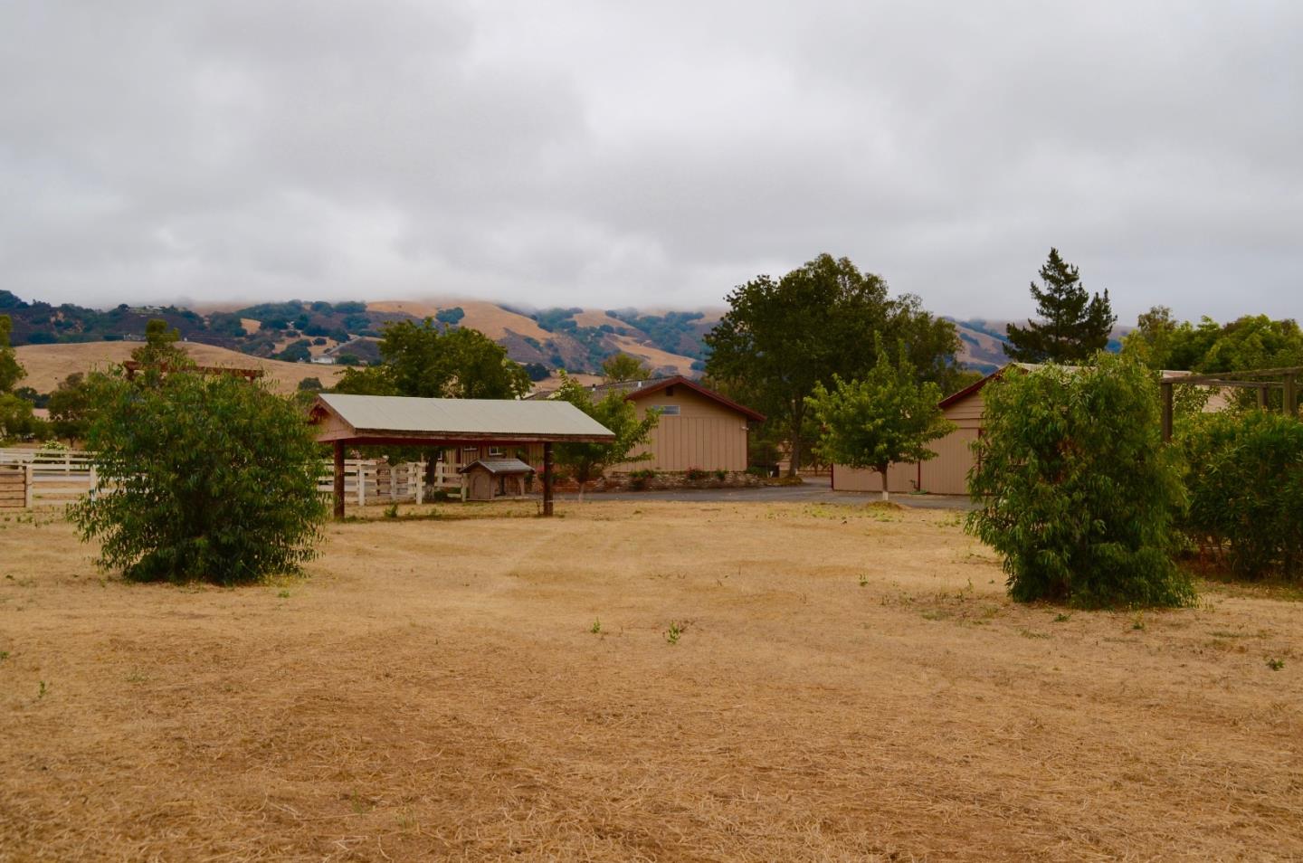 2890 Roop Road Gilroy, CA 95020 - Photo 20 of 22 a view of a house with a yard and sitting area