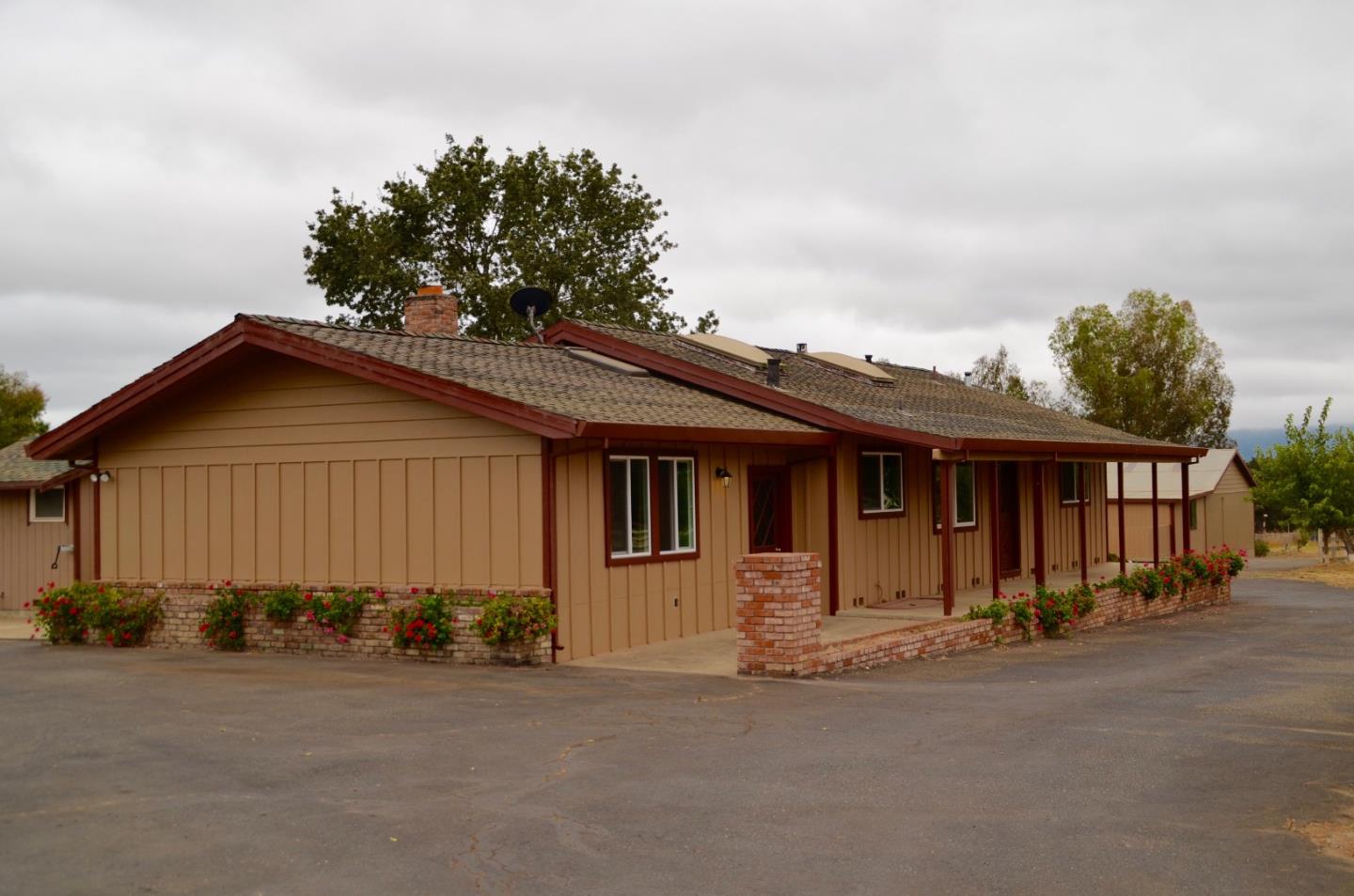 2890 Roop Road Gilroy, CA 95020 - Photo 3 of 22 front view of a house with a street