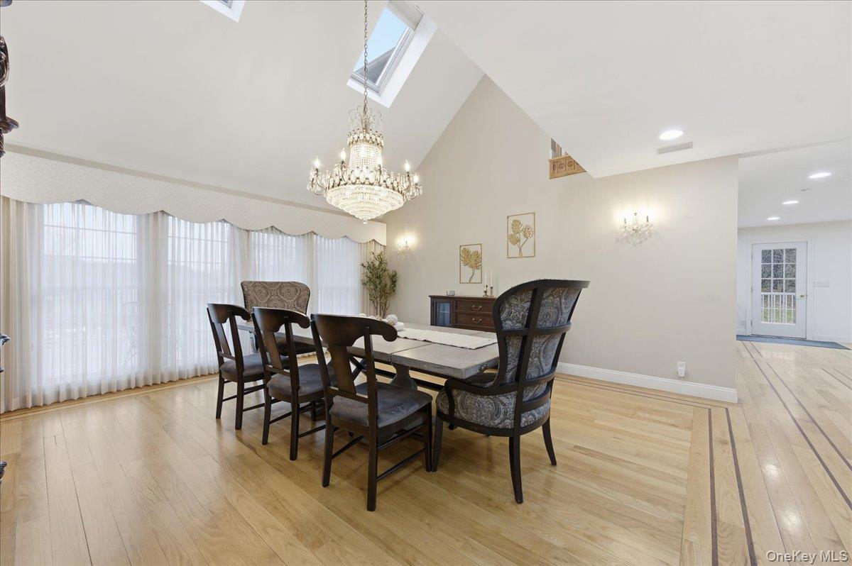 627 Green Lake Road Catskill, NY 12414 - Photo 15 of 50 a view of a dining room with furniture and wooden floor