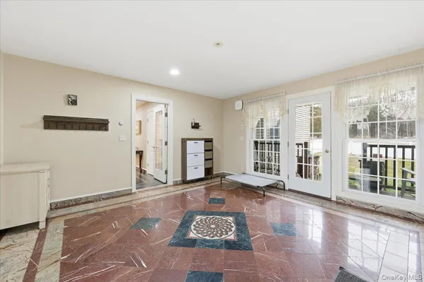 a view of an empty room with glass door