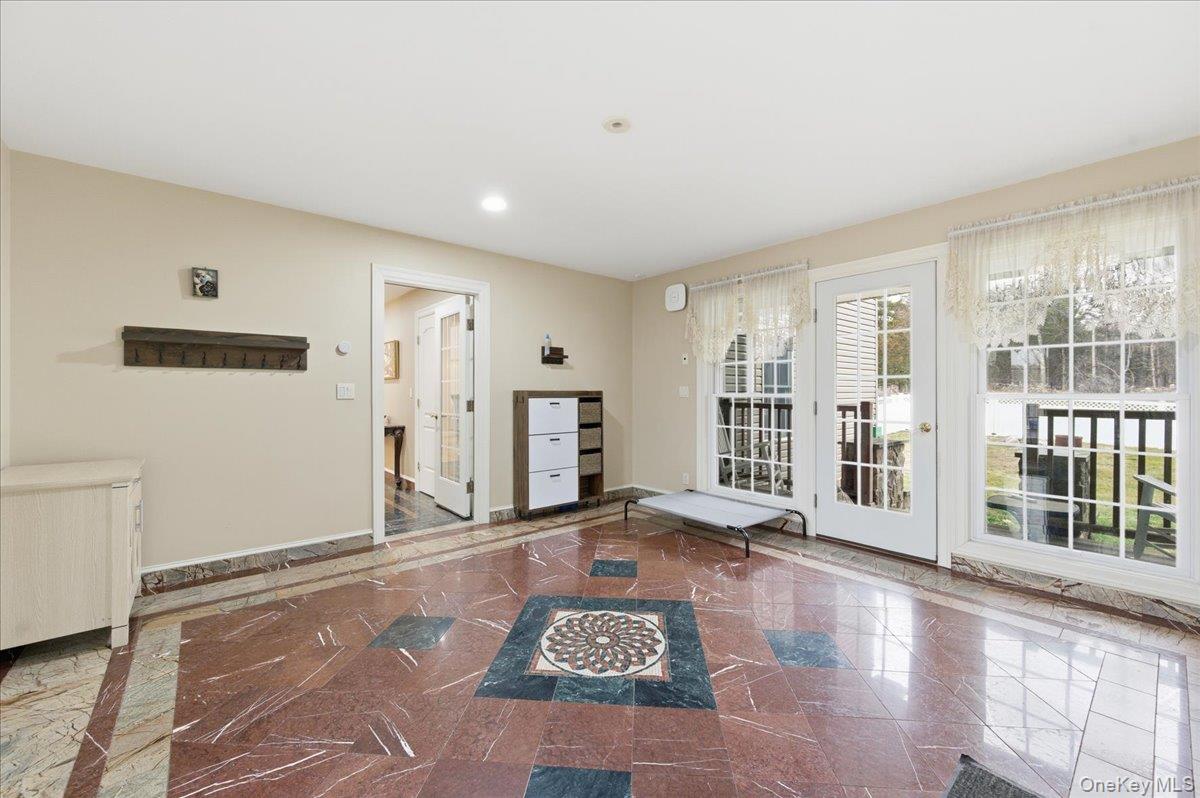627 Green Lake Road Catskill, NY 12414 - Photo 18 of 50 a view of an empty room with glass door