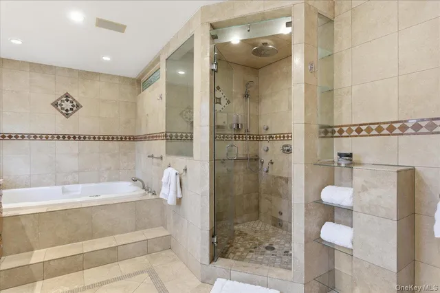 a bathroom with a shower and a bathtub