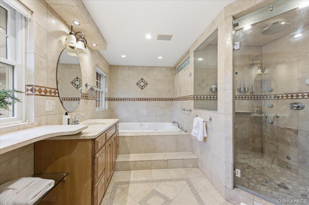 627 Green Lake Road Catskill, NY 12414 - Photo 36 of 50 a spacious bathroom with a bathtub shower sink mirror and toilet