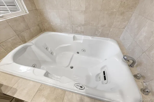 a bathroom with a white tub