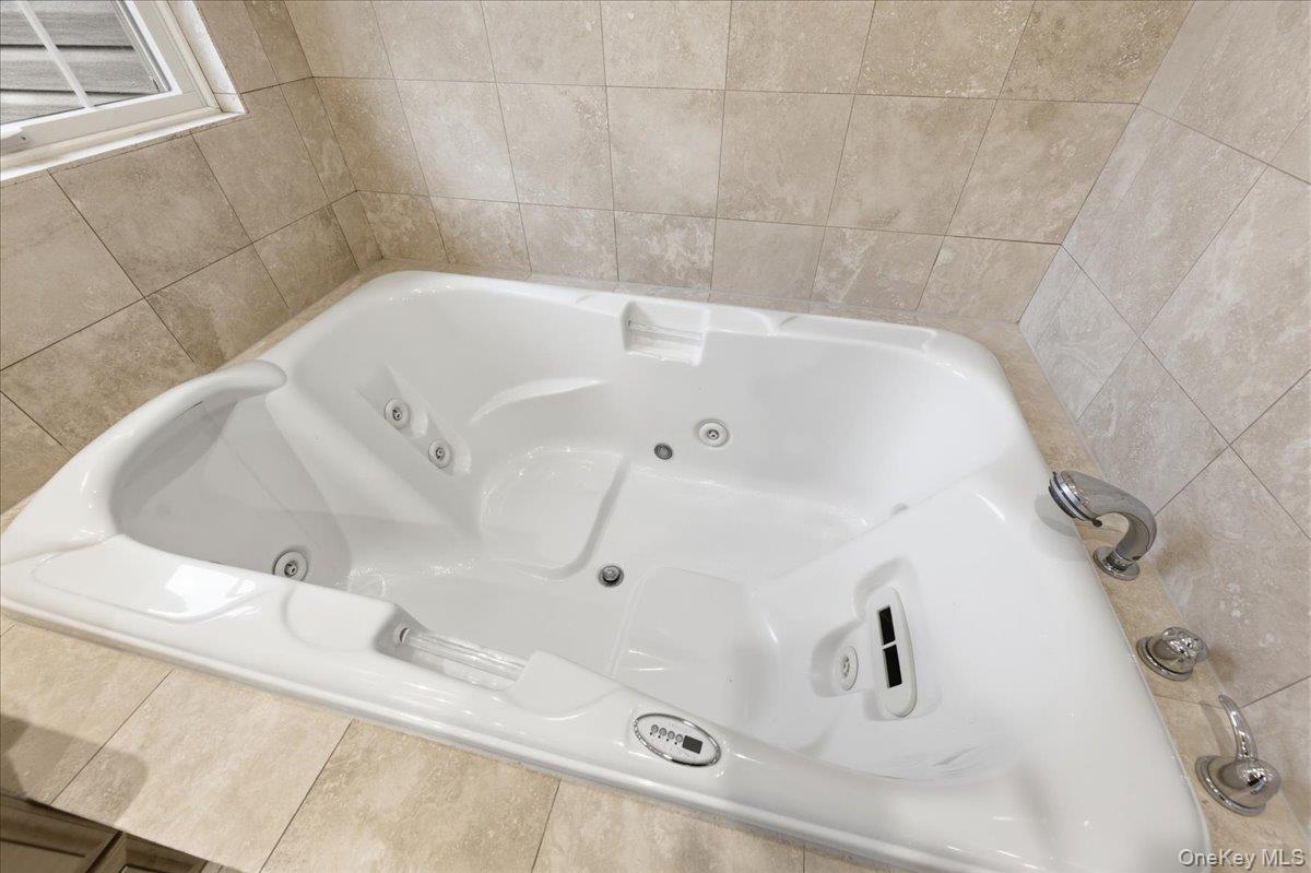 627 Green Lake Road Catskill, NY 12414 - Photo 37 of 50 a bathroom with a white tub