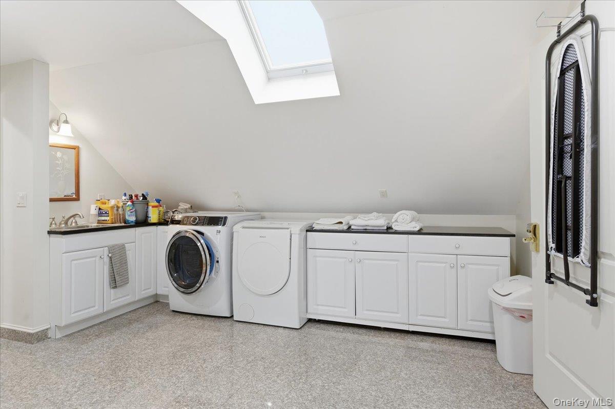 627 Green Lake Road Catskill, NY 12414 - Photo 42 of 50 a utility room with cabinets washer and dryer