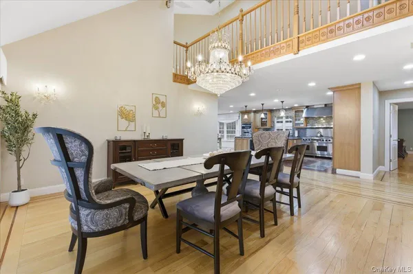 a view of a dining area with furniture and kitchen view