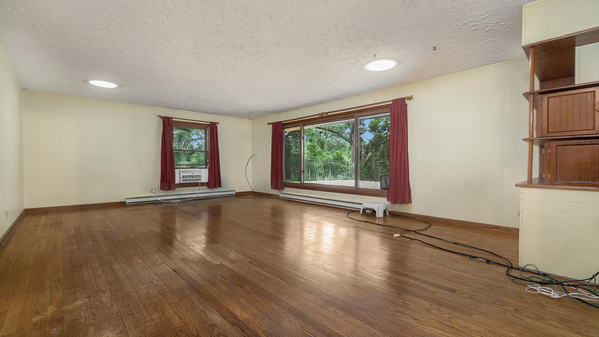 35340 West County Line Road Kirkland, IL 60146 - Photo 20 of 45 wooden floor in an empty room with a window