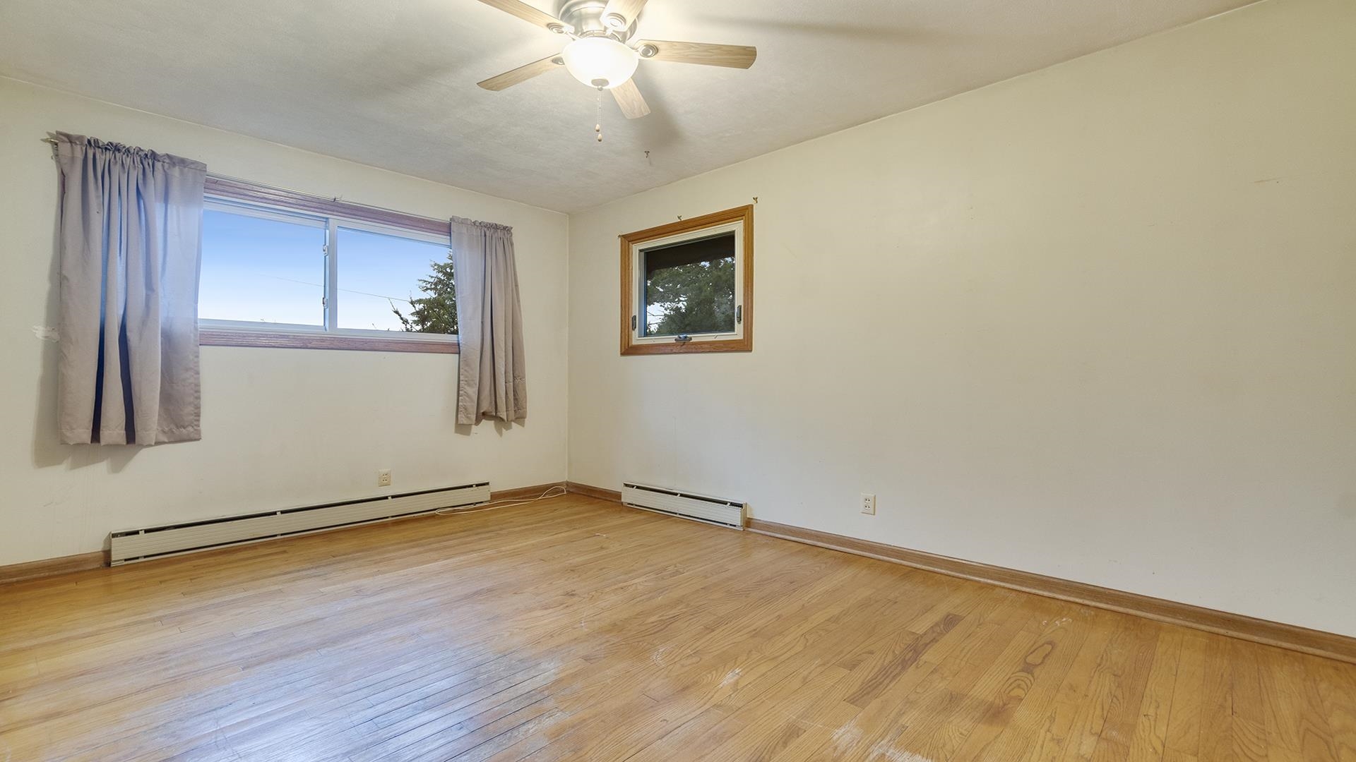 35340 West County Line Road Kirkland, IL 60146 - Photo 22 of 45 a view of an empty room with wooden floor and a window