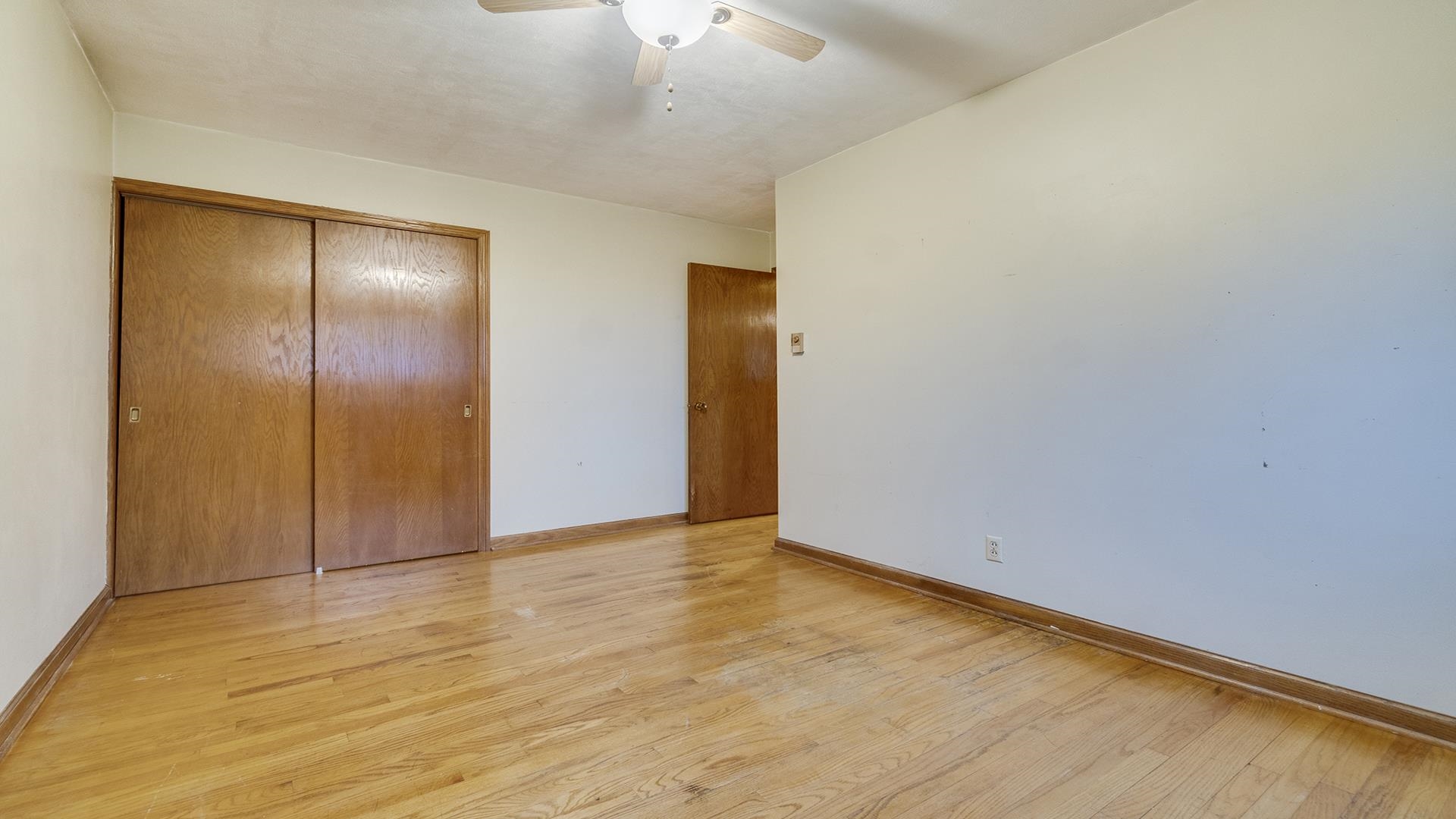 35340 West County Line Road Kirkland, IL 60146 - Photo 23 of 45 a view of an empty room with closet and a chandelier fan