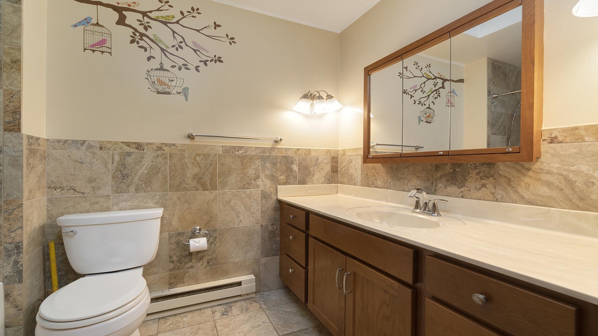 35340 West County Line Road Kirkland, IL 60146 - Photo 24 of 45 a bathroom with a toilet sink and mirror