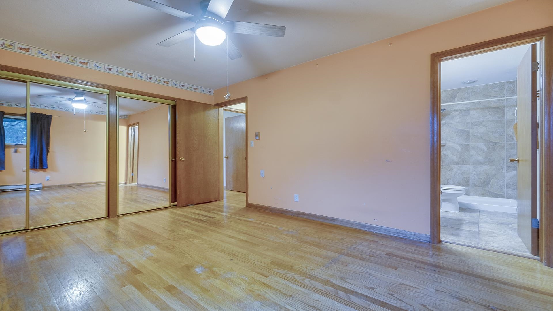 35340 West County Line Road Kirkland, IL 60146 - Photo 29 of 45 a view of an empty room with wooden floor and a window