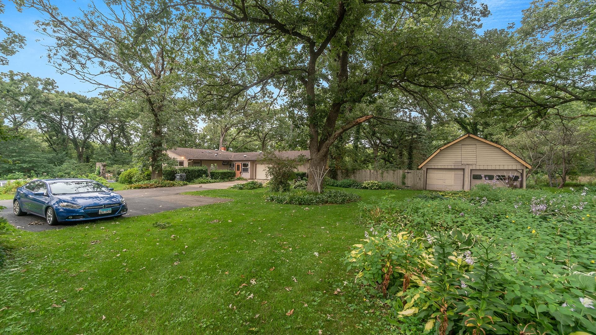 35340 West County Line Road Kirkland, IL 60146 - Photo 10 of 45 a front view of a house with garden