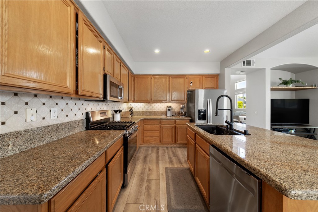 32985 Novara Court Temecula, CA 92592 - Photo 24 of 56 Functional Kitchen Layout With Extensive Counter Space And Storage