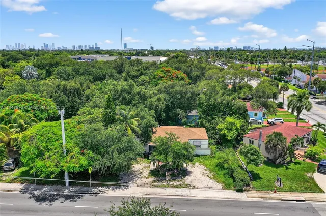 an aerial view of house with yard