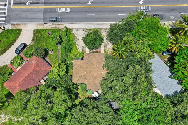 an aerial view of residential house with outdoor space and street view