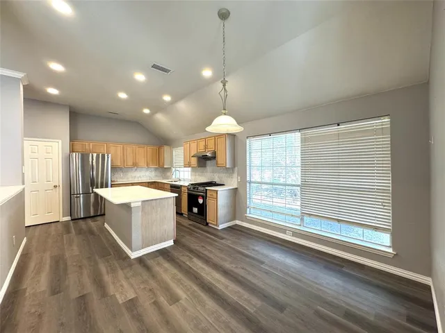 a large kitchen with a lot of counter space
