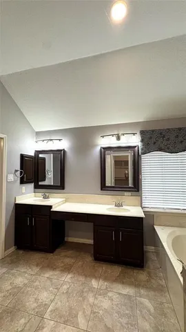 a kitchen with stainless steel appliances a sink and a stove
