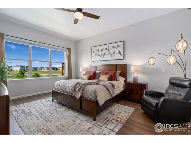 a bed room with a bed window and a dresser