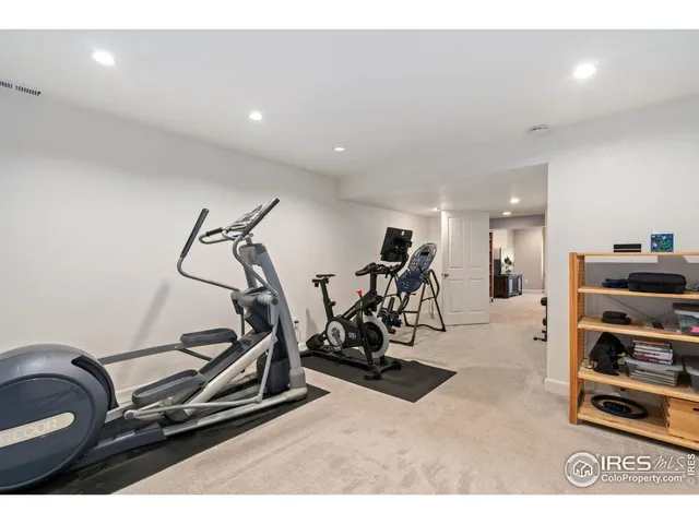 a bedroom with a bed and a potted plant