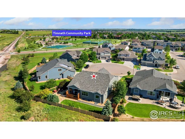 a picture of city with lots of residential buildings and ocean view