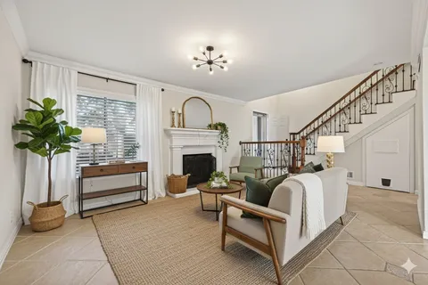 a kitchen with stainless steel appliances kitchen island granite countertop a stove a refrigerator and a sink