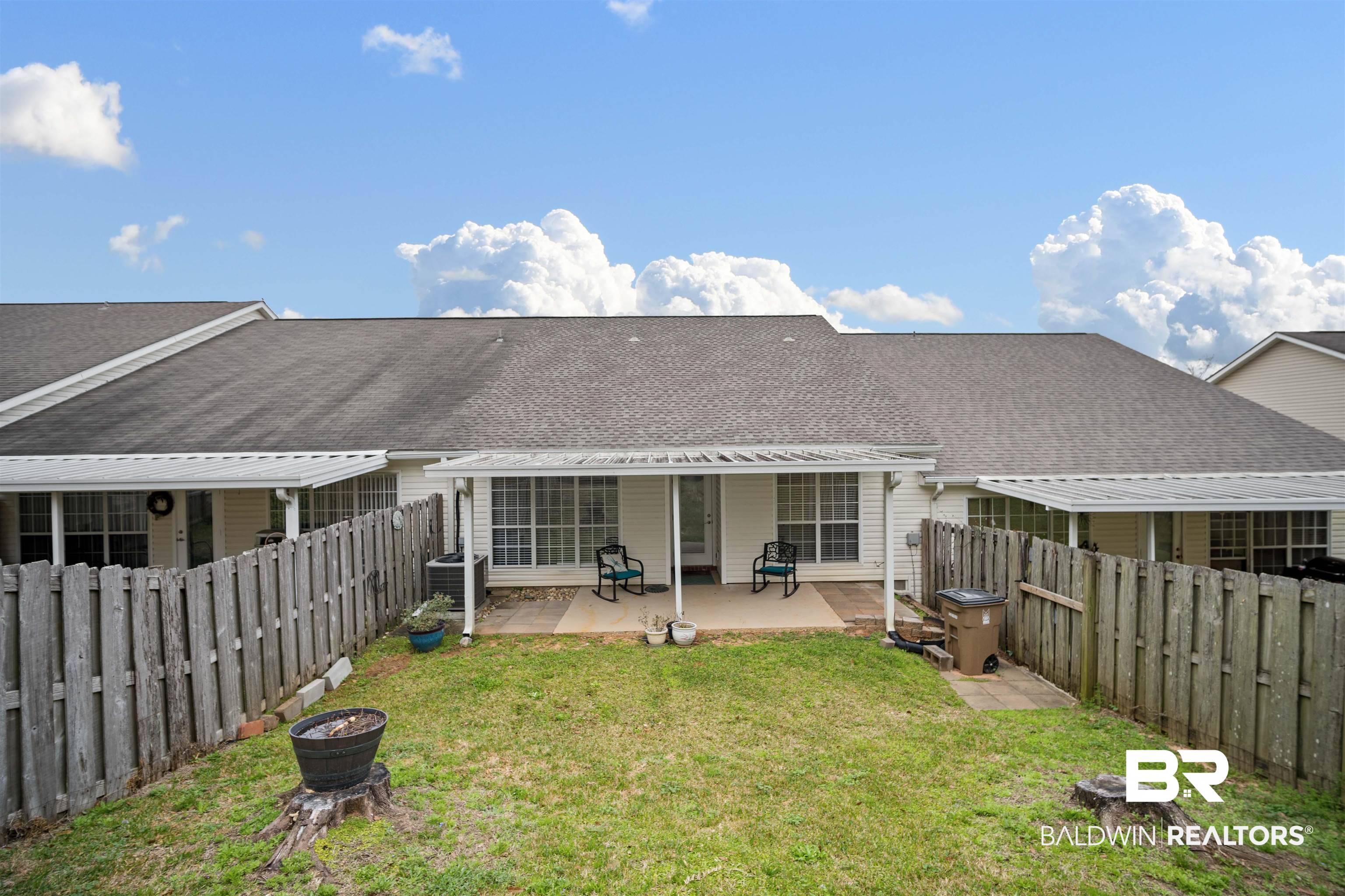 628 Spring Lake Court Mobile, AL 36695 - Photo 25 of 25 Back of property featuring cooling unit, a patio area, and a lawn