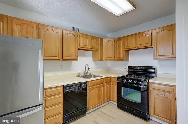 a kitchen with a stove and a sink