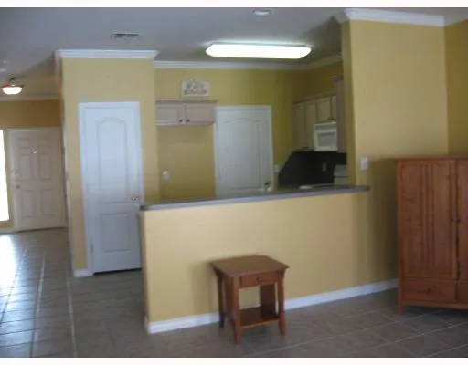 a kitchen with a sink and a refrigerator