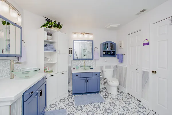 a spacious bathroom with a sink toilet and shower