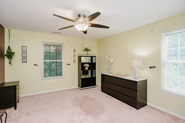 a living room with furniture window and wooden floor