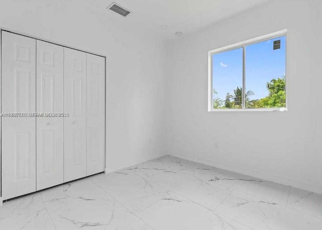 2145 Northwest 4th Street, Unit 2145 Pompano Beach, FL 33069 - Photo 10 of 13 a view of an empty room