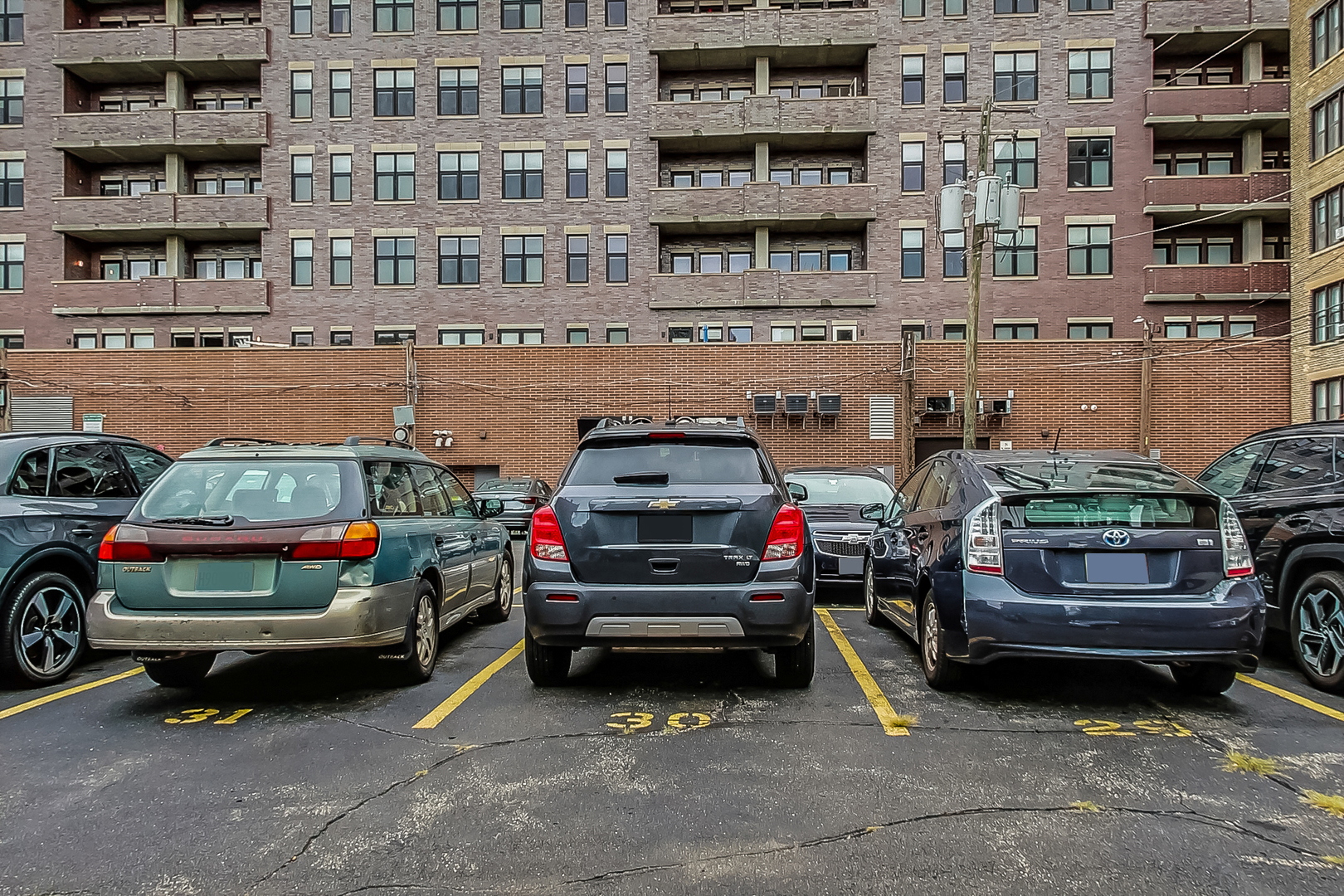 725 West Sheridan Road, Unit 402 Chicago, IL 60613 - Photo 30 of 31 a view of cars parked in a parking lot