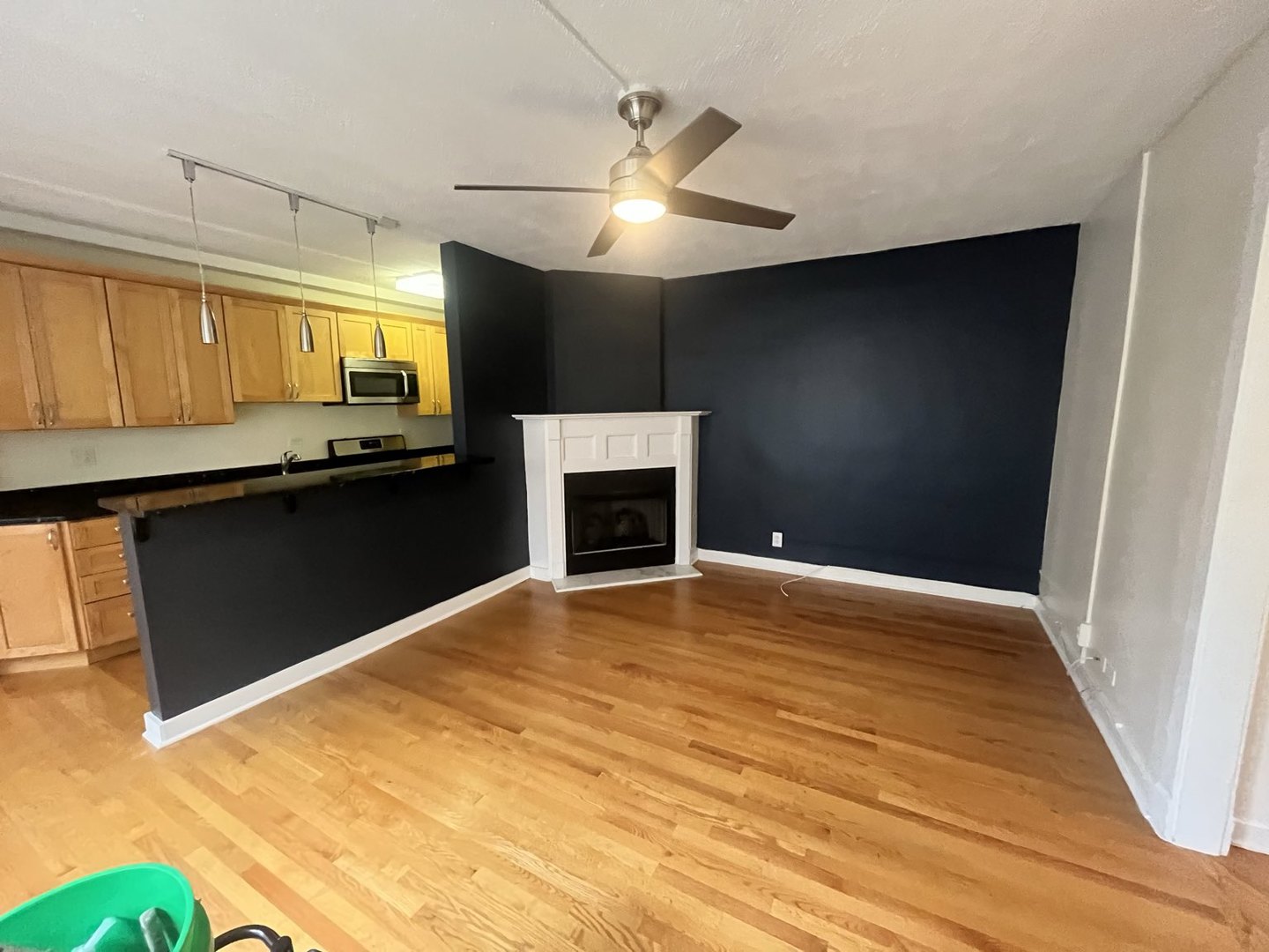 725 West Sheridan Road, Unit 402 Chicago, IL 60613 - Photo 8 of 31 a view of empty room with a fireplace and a window