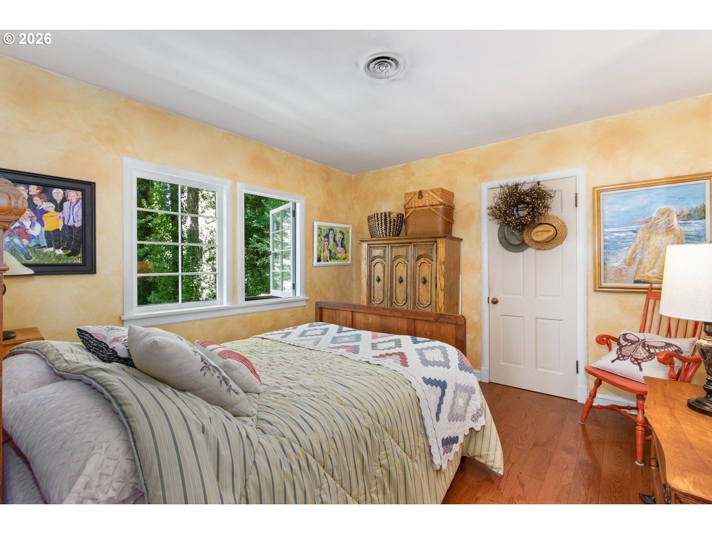 4300 Pacific Way Longview, WA 98632 - Photo 16 of 33 a bedroom with a bed and wooden floor