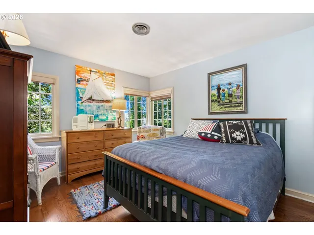 a bed room with a bed and a large window