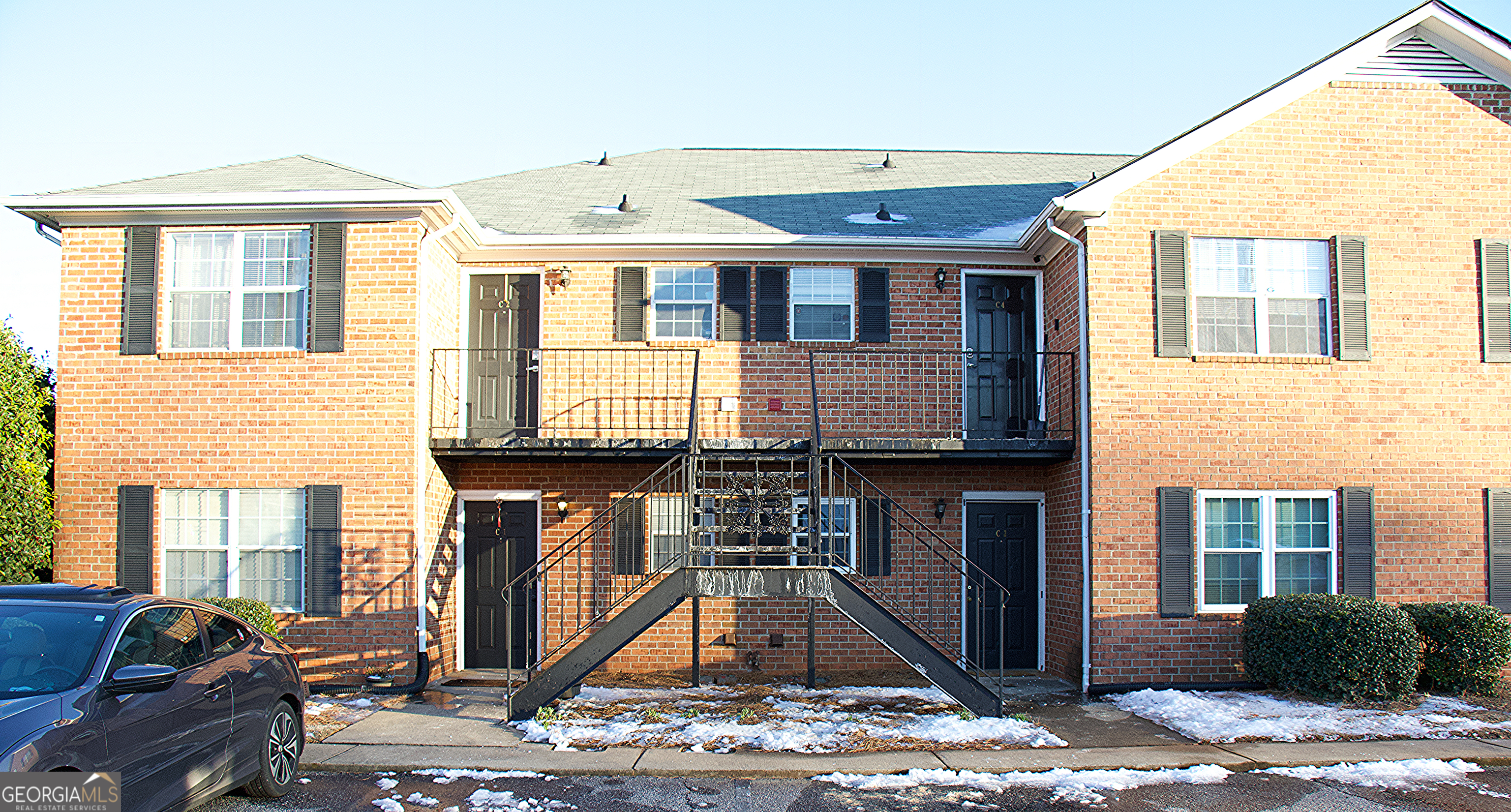 a front view of a house with parking space