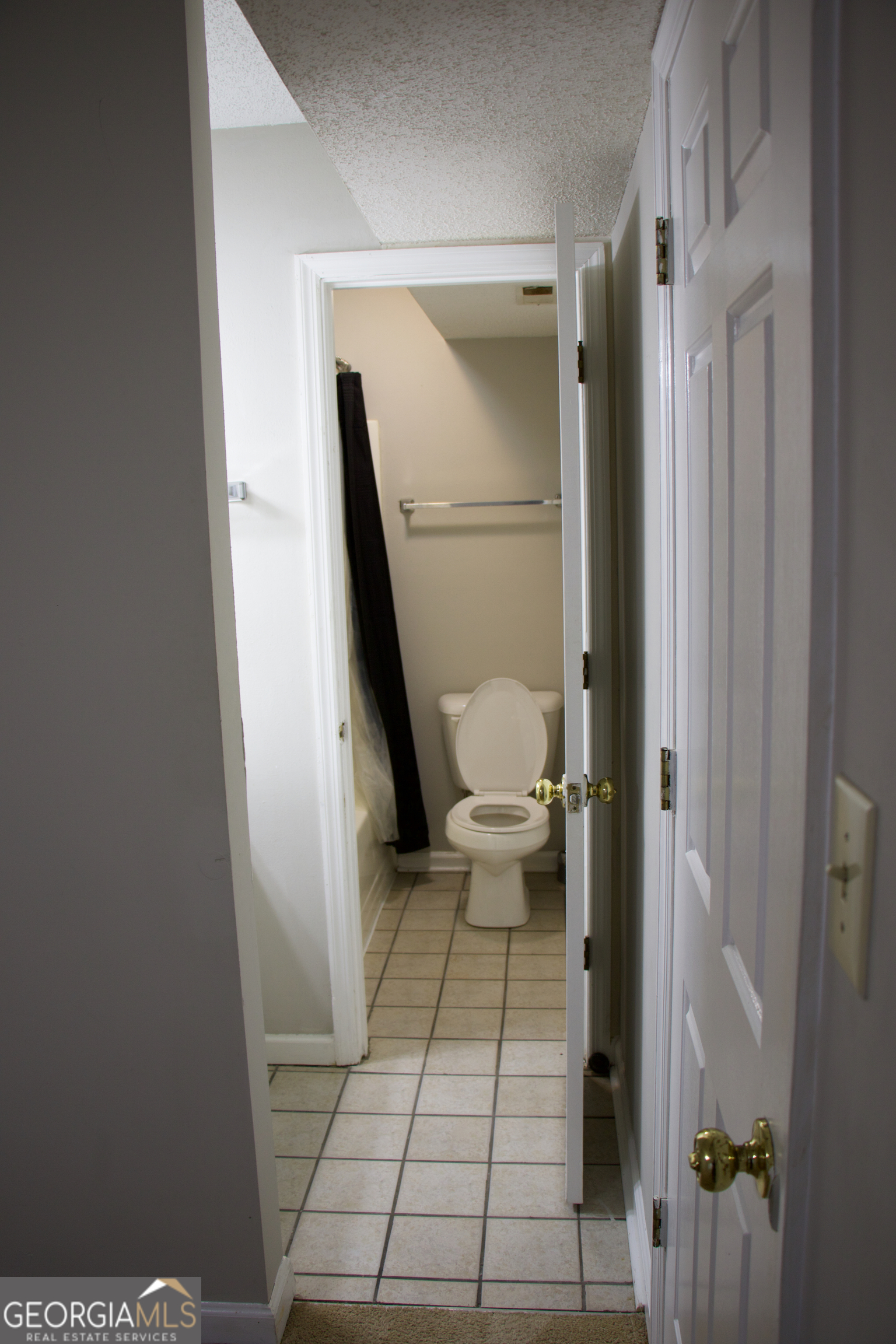 2165 South Milledge Avenue, Unit C1 Athens, GA 30605 - Photo 11 of 15 a bathroom with a toilet and a shower