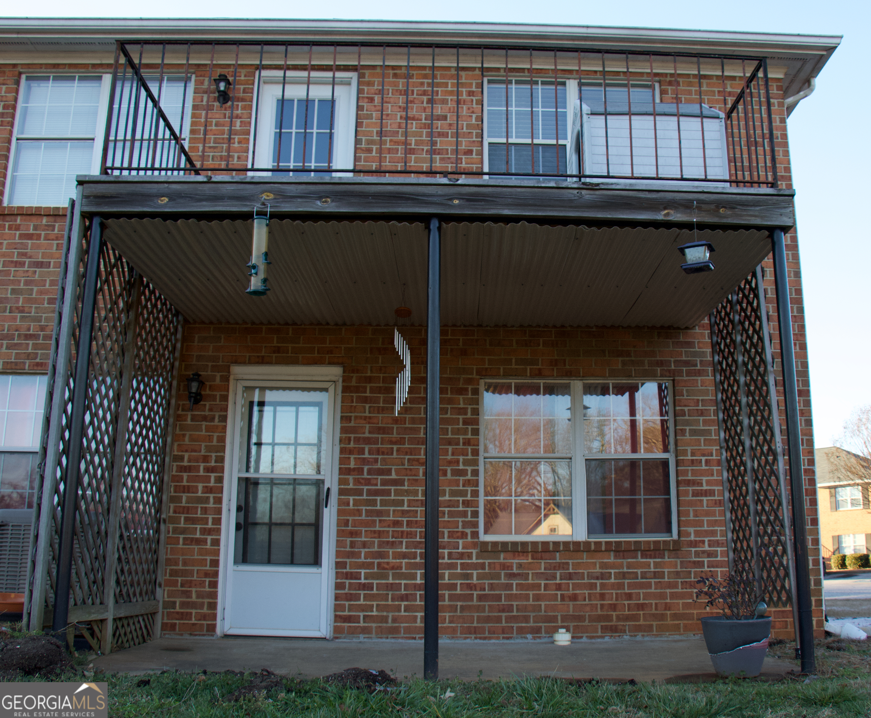 2165 South Milledge Avenue, Unit C1 Athens, GA 30605 - Photo 2 of 15 a front view of a house with a garden