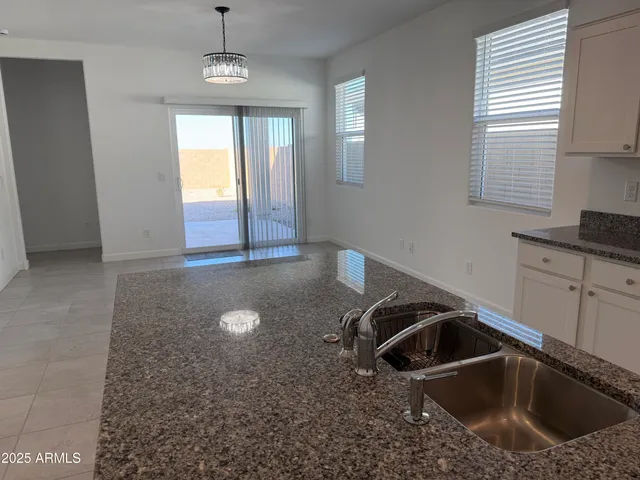 a kitchen that has a sink and a stove