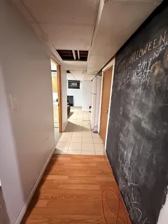 a hallway with two windows