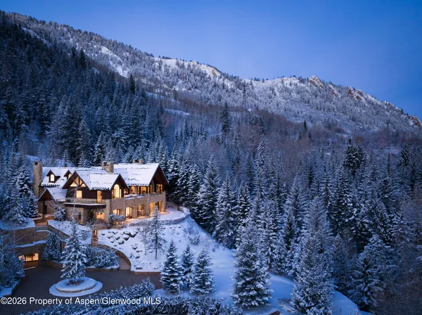 a view of a backyard with table and chairs