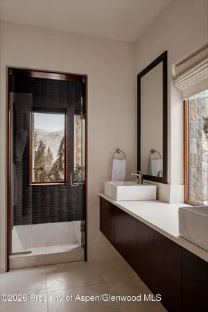 a bathroom with a bathtub and a sink