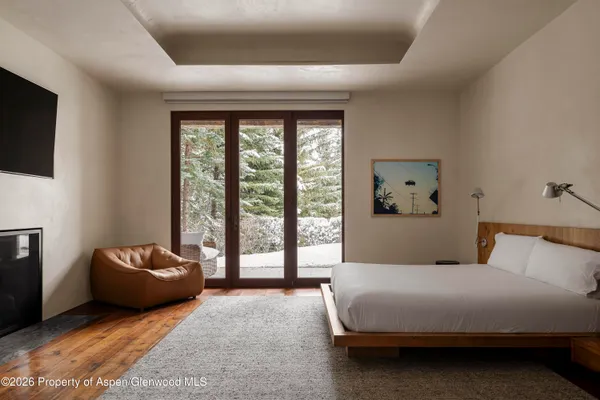 a bedroom with a bed and a couch