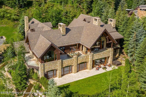 an aerial view of a house with a garden