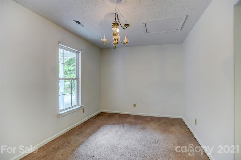 239 Valleyview Road Mooresville, NC 28117 - Photo 16 of 41 an empty room with a window