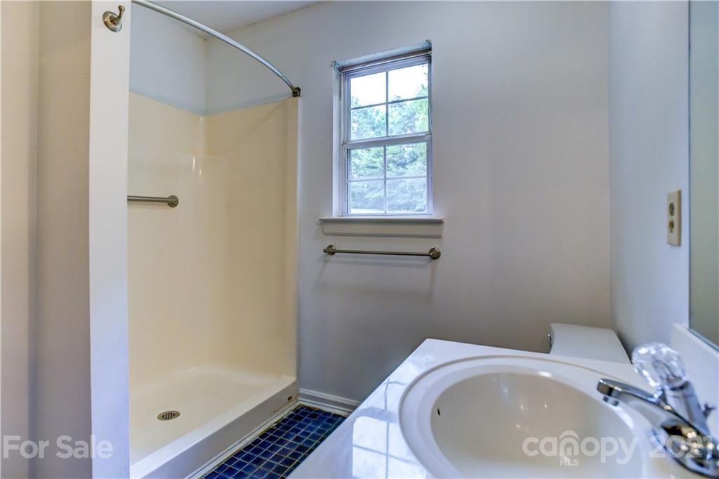 239 Valleyview Road Mooresville, NC 28117 - Photo 24 of 41 a bathroom with a sink and a toilet