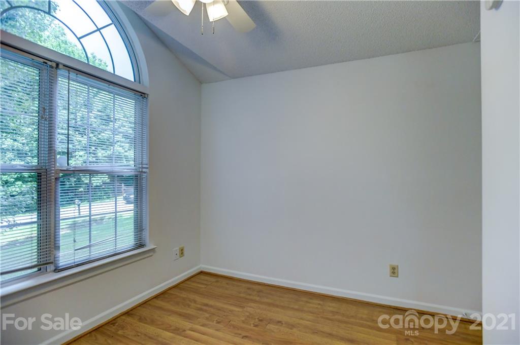 239 Valleyview Road Mooresville, NC 28117 - Photo 28 of 41 a view of a room with wooden floor and windows
