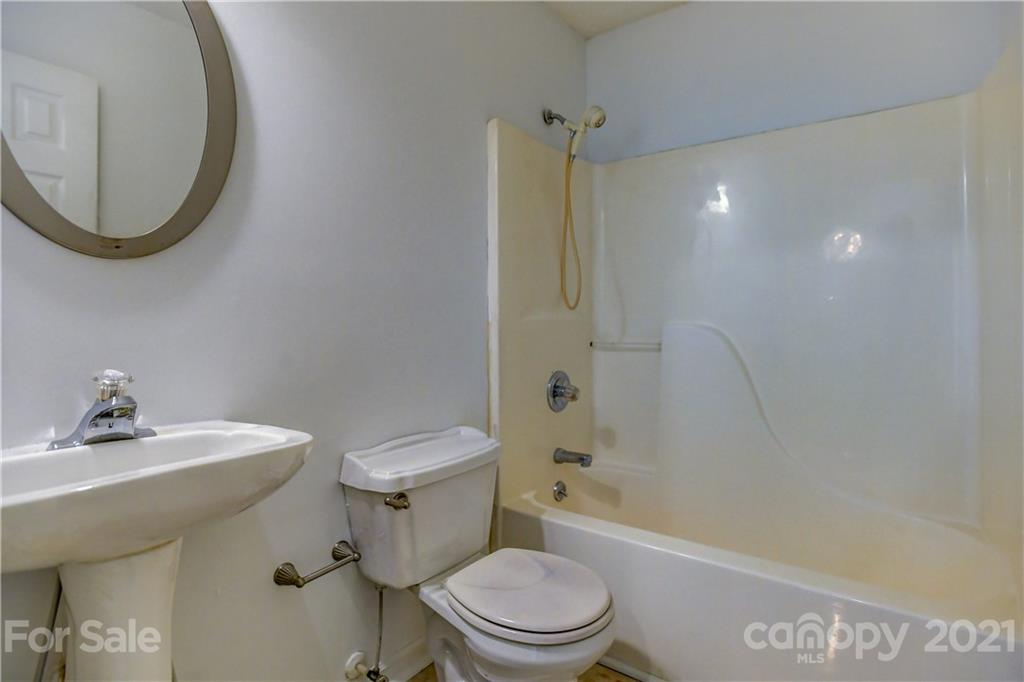239 Valleyview Road Mooresville, NC 28117 - Photo 29 of 41 a bathroom with a sink a toilet and shower